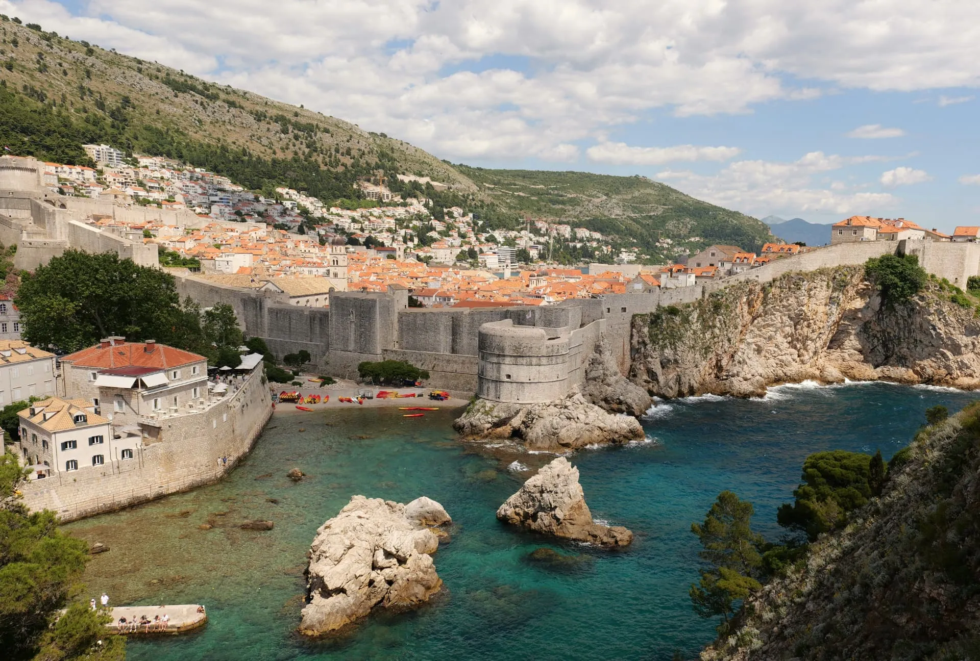 Dubrovnik Old Town walls and Fort Bokar above the clear water of Pile bay